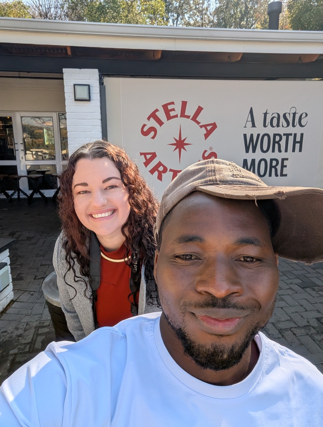 Aromaradu Abdulkabir smiling at an outdoor brand event